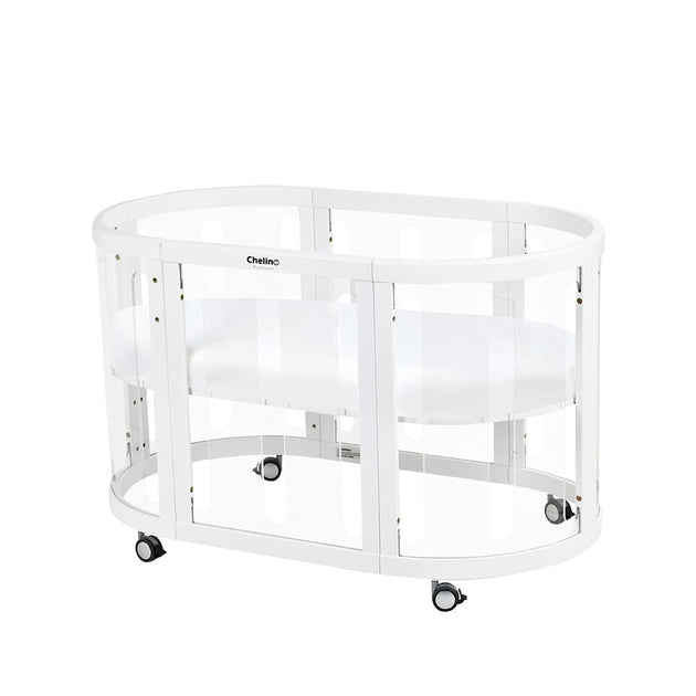 Selina 5 in 1 Cot White with clear panels and wheels, made from sustainable oak wood.