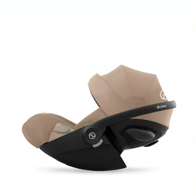 Cloud G i-Size almond beige infant car seat with ergonomic lie-flat position and 180° rotation for infants up to 24 months.