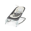 Ingenuity Happy Belly Rock-to-Bounce Massage Seat with plush infant insert and detachable toy bar in gray and beige colors
