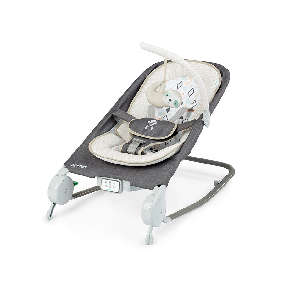Ingenuity Happy Belly Rock-to-Bounce Massage Seat with plush infant insert and detachable toy bar in gray and beige colors