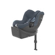 Cybex car seat with attached cup holder for child drinks.