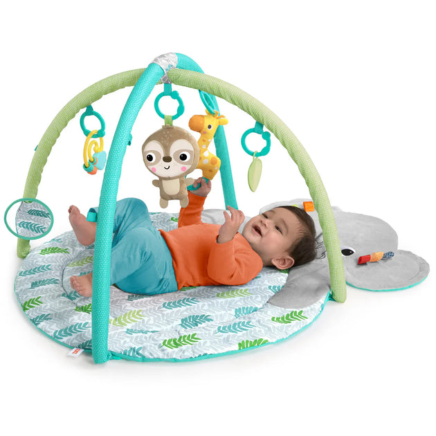 Baby on Hug n Cuddle Elephant Activity gym with attached toys.