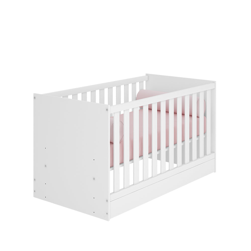 White Trinity 2 in 1 Convertible Baby Cot with pink bedding, designed to transition from crib to toddler bed
