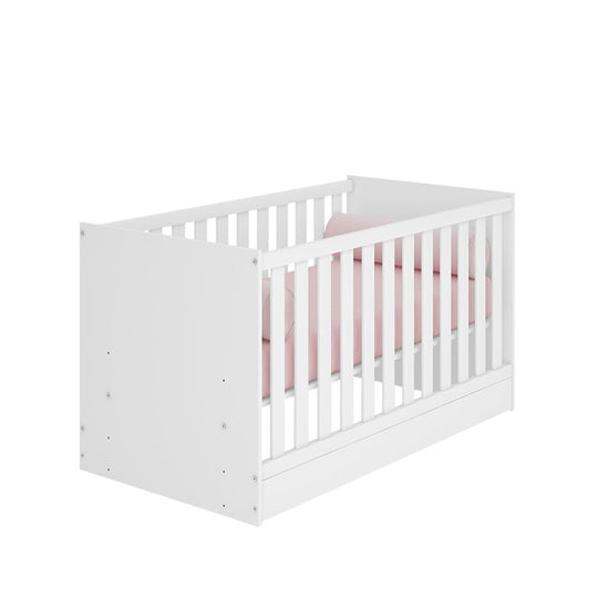 White Trinity 2 in 1 Convertible Baby Cot with pink bedding, designed to transition from crib to toddler bed