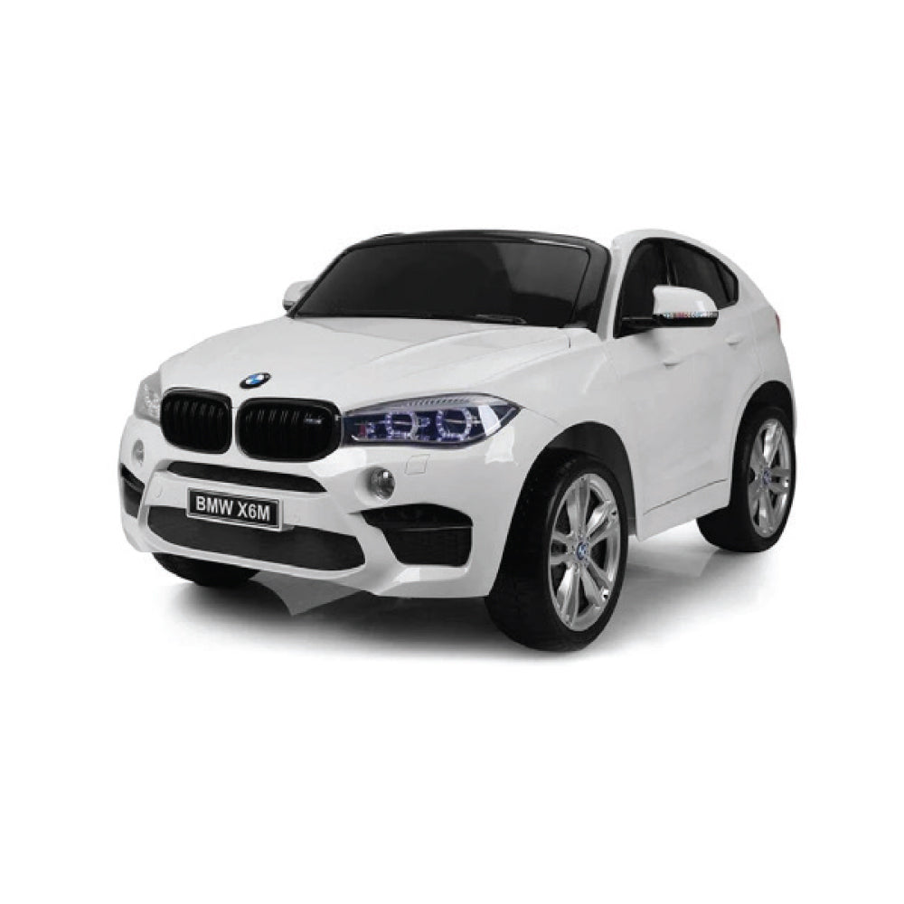 BMW X6 White Ride On Car for kids with realistic design, LED headlights, and safety seatbelt.