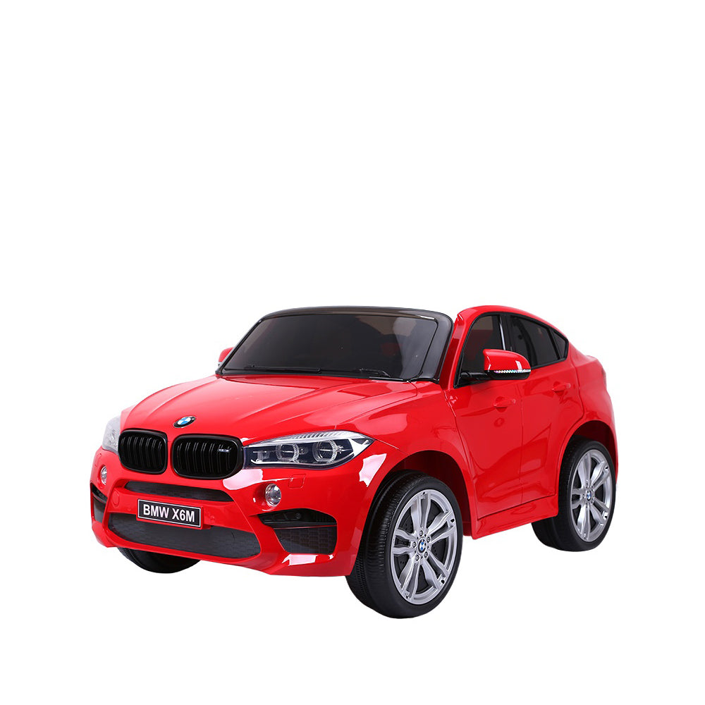 Red BMW X6 ride-on car for children, featuring realistic details and modern design.