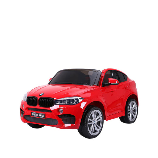 Red BMW X6 ride-on car for children, featuring realistic details and modern design.