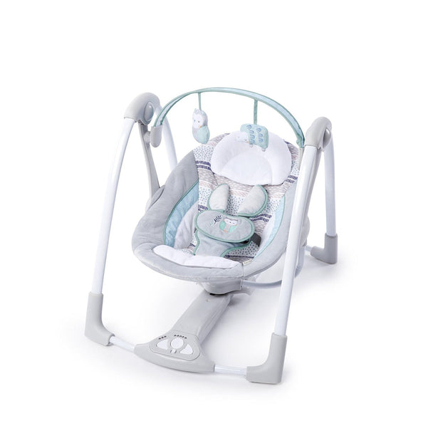 Portable Ingenuity Power Adapt Swing Abernathy with plush seat, hanging toys, and automatic swinging motion