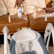 Ingenuity Swing 'N' Go Portable Swing - Chambray with removable toy bar and plush seating.