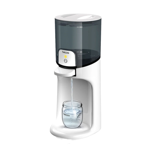 Baby Brezza Instant Warmer dispensing water into a jar.