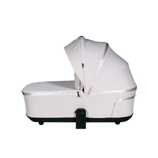 Lunar II Carry Cot in beige with breathable canopy and sun protection.