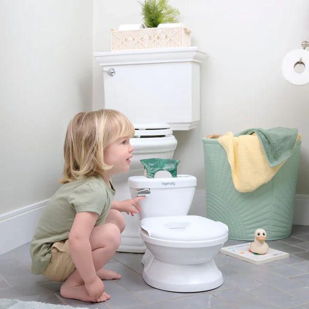 Toddler using the Fantastic Potty, ING My Size Potty Pro, resembling an adult toilet.