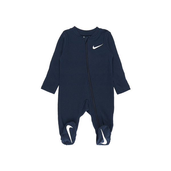 Nike Baby Essential Pointelle Coverall in Midnight Navy with white Swoosh, footed design, and long sleeves for cozy comfort.