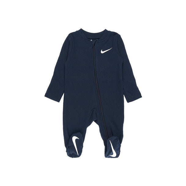 Nike Baby Essential Pointelle Coverall in Midnight Navy with white Swoosh, footed design, and long sleeves for cozy comfort.