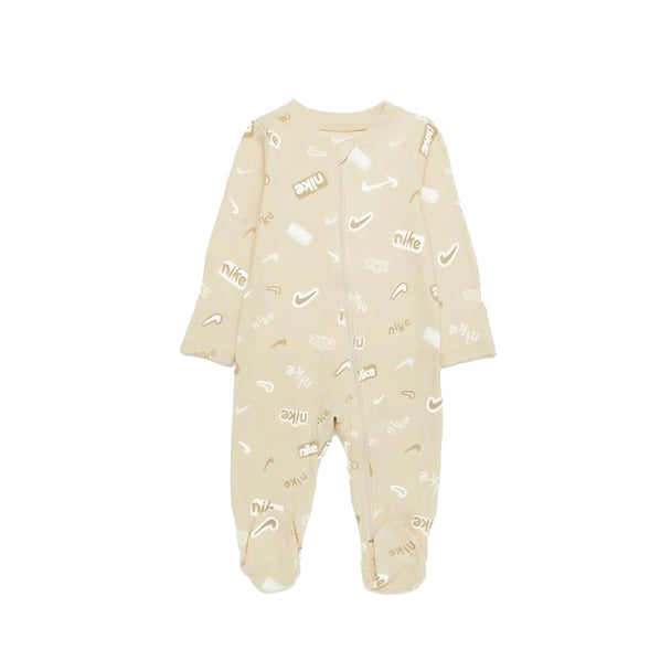 Nike E1D1 AOP Footed Coverall in sanddrift color with allover Nike print and full-zip front.