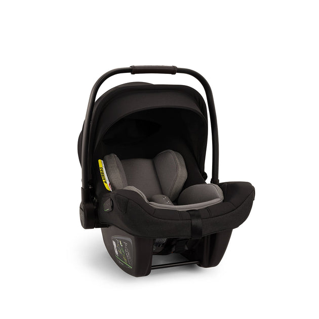 Nuna Pipa™ Next Infant Car Seat in Caviar, lightweight and versatile, with adjustable headrest and superior side impact protection.