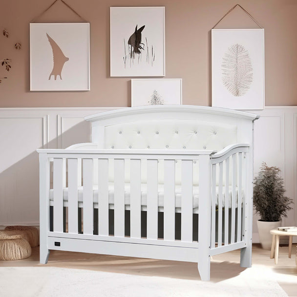 Sophie Cot with arched headboard and diamond accents in a stylish nursery setting.