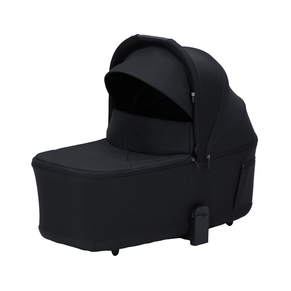 Lunar URBN Lux carry cot in black fabric, with an extended canopy, zippered cover and integrated carry handle.