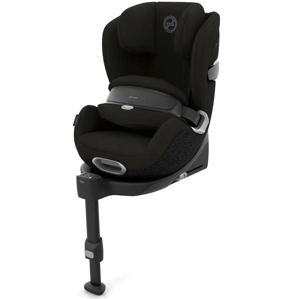 Black fabric Aton B2 car seat with padded headrest, adjustable impact shield, contoured sides and support leg.