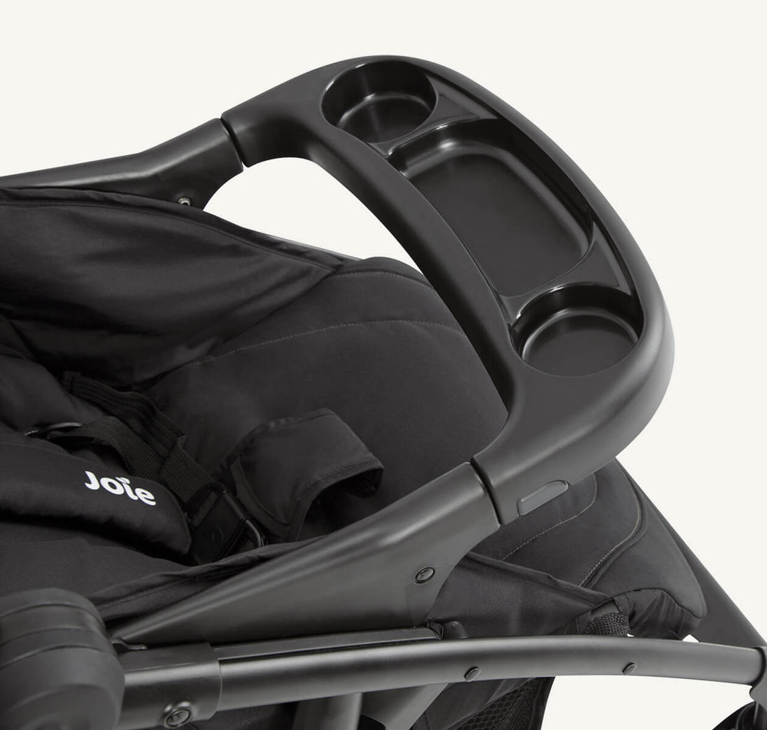 Joie Muze™ lx stroller in black fabric with a padded seat, harness straps and molded tray with cup holders