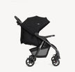 Joie Muze™ lx stroller in black with a wide canopy, padded seat, adjustable handle and storage basket