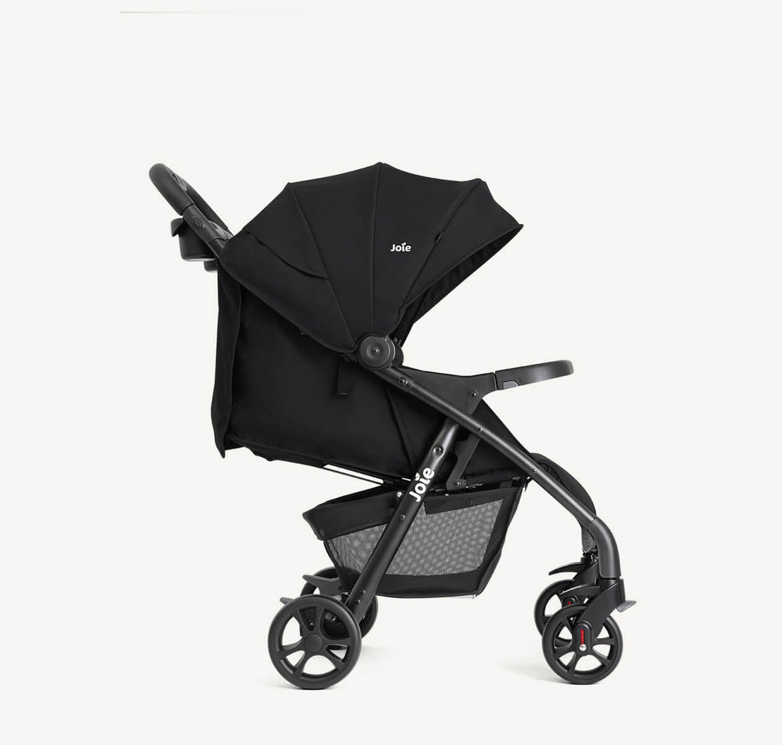 Joie Muze™ lx stroller in black with a wide canopy, padded seat, adjustable handle and storage basket