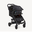Joie Muze™ lx travel system in black fabric, featuring a matching infant car seat mounted on a wheeled stroller