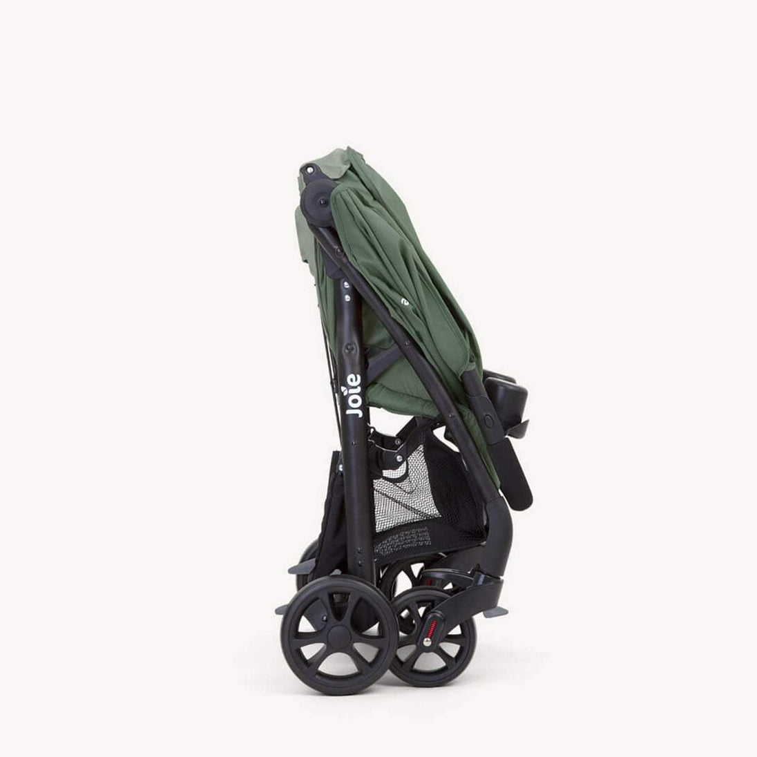 Joie Muze™ lx stroller folded with a sage green fabric canopy, black frame, mesh storage basket and cup holder