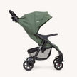Joie Muze™ lx stroller in sage green fabric with black frame, folding canopy, mesh storage basket and four wheels