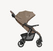 Joie Muze™ lx stroller with a taupe fabric canopy and seat, black frame, three wheels and mesh storage basket