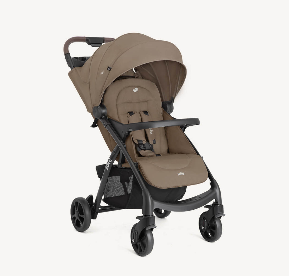 Joie Muze™ lx stroller in taupe fabric with a matching canopy, padded seat, safety harness and black frame